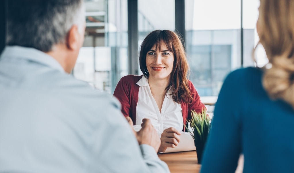 Businesswoman Meets With Two Businesspeople Businesswoman Meets With Two Businesspeople