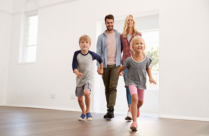 Family walking into new house