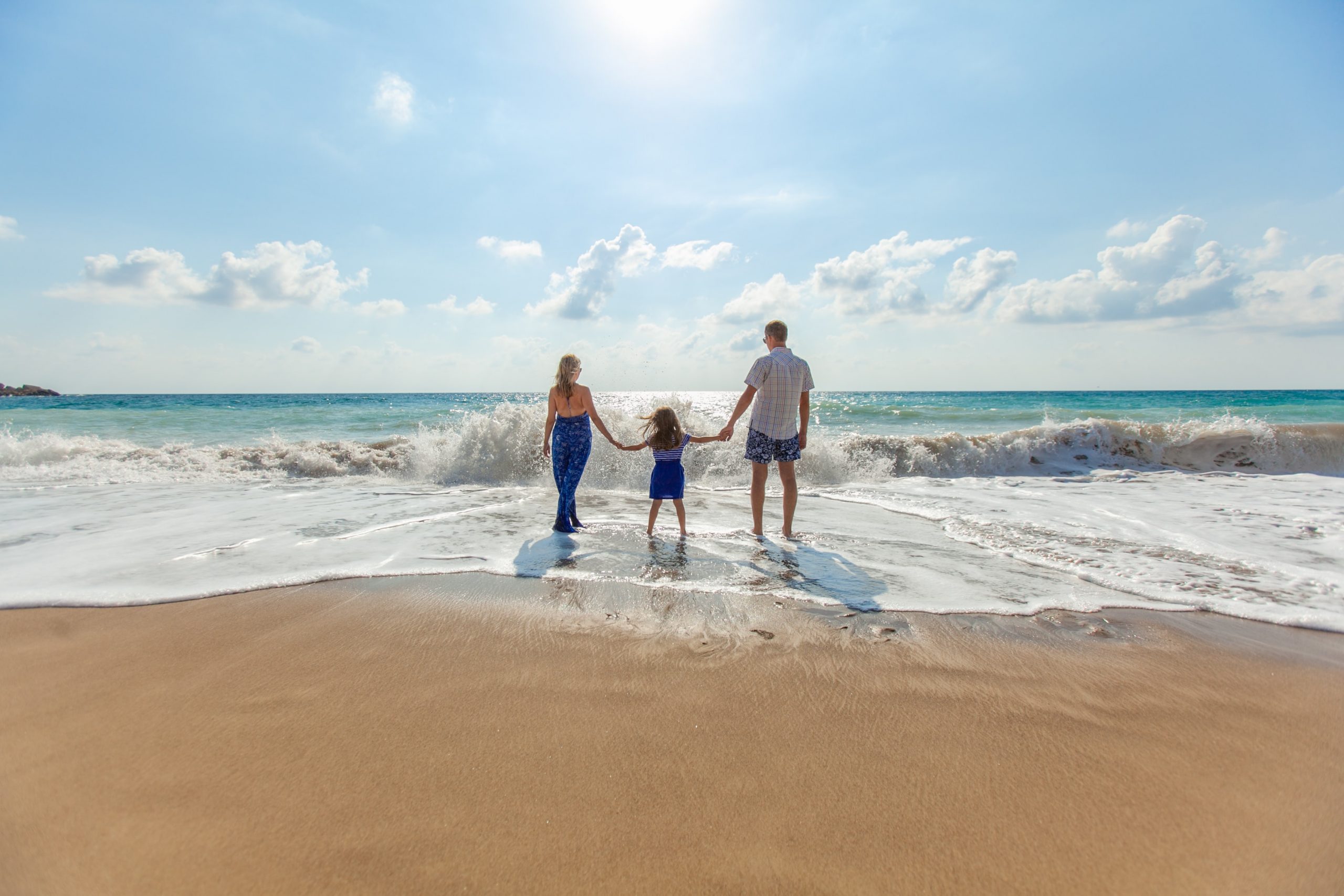 Young-Family-Playing-Beach-Travel-Protection-Insurance-Tower-Street-Insurance-Dallas-TX