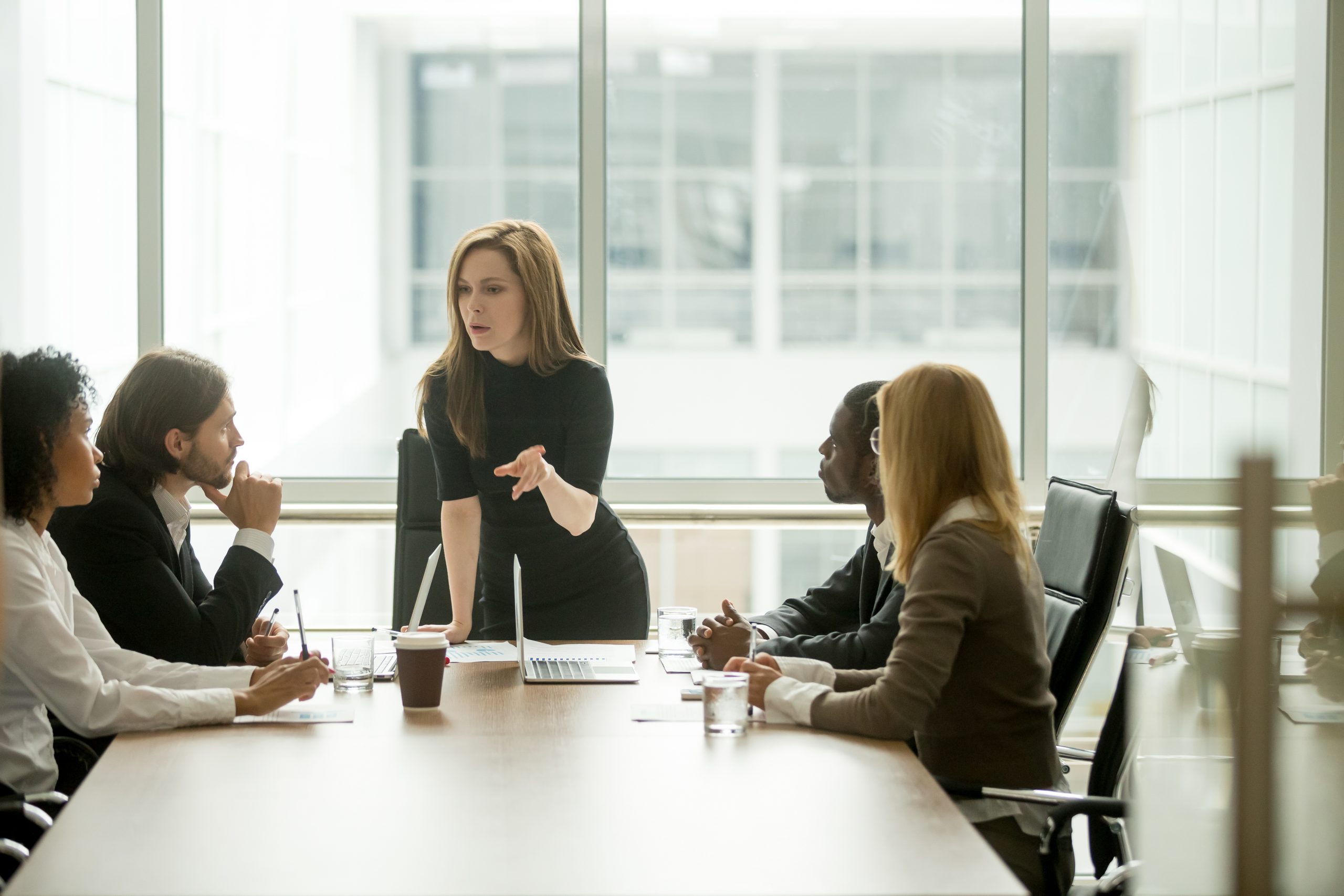 Serious,Woman,Boss,Scolding,Employees,For,Bad,Results,Or,Discussing