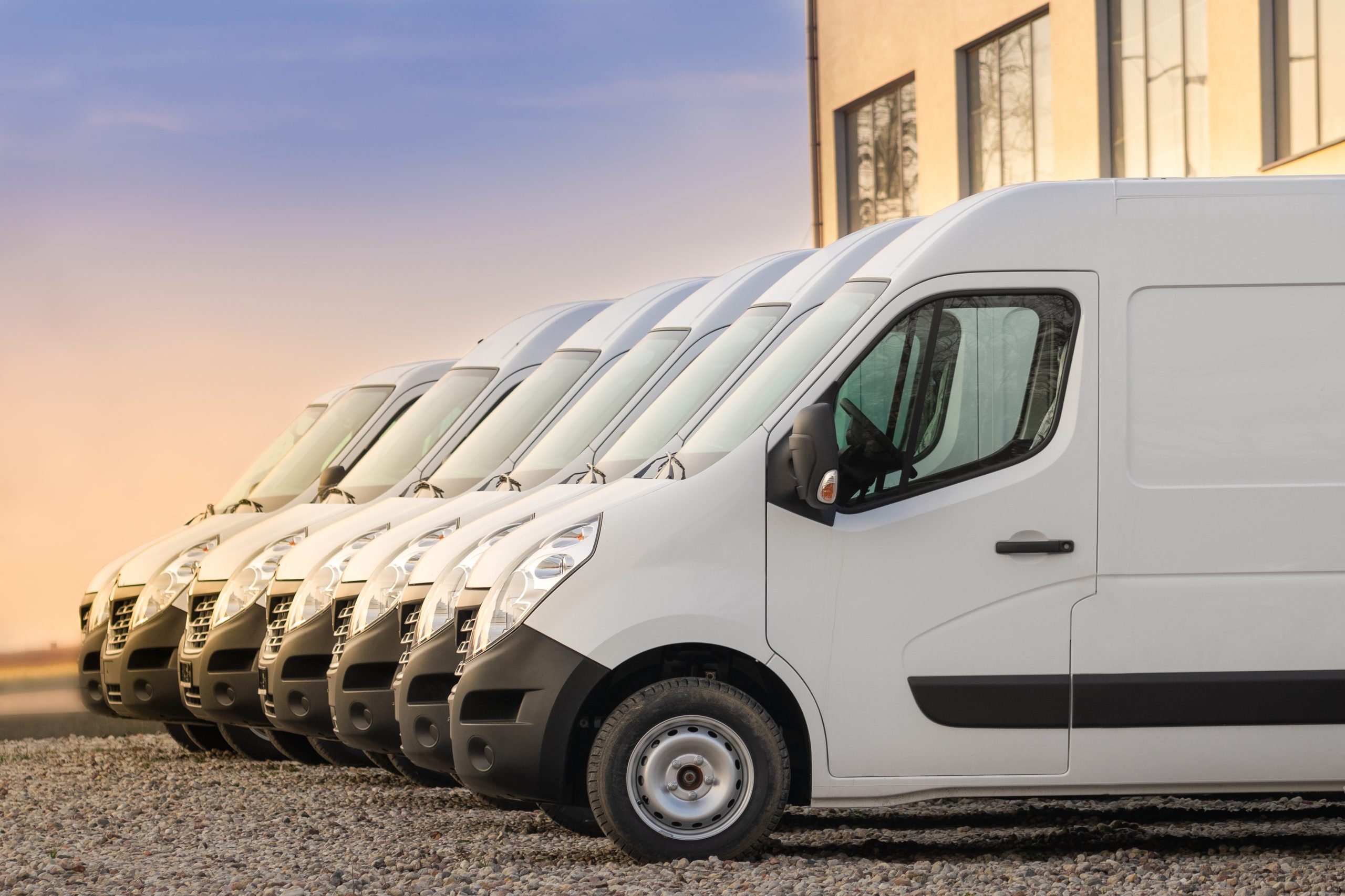 Commercial,Delivery,Vans,Parked,In,Row.,Transporting,Service,Company.