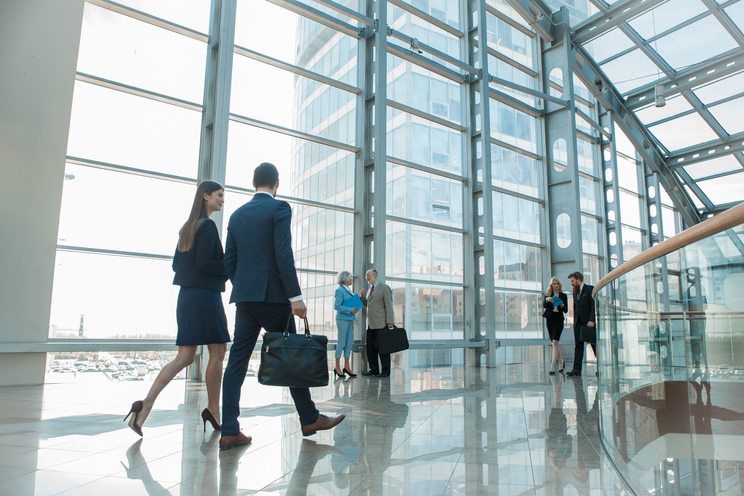 Business,People,Walking,In,Modern,Glass,Office,Building Business People Walking In Modern Glass Office Building