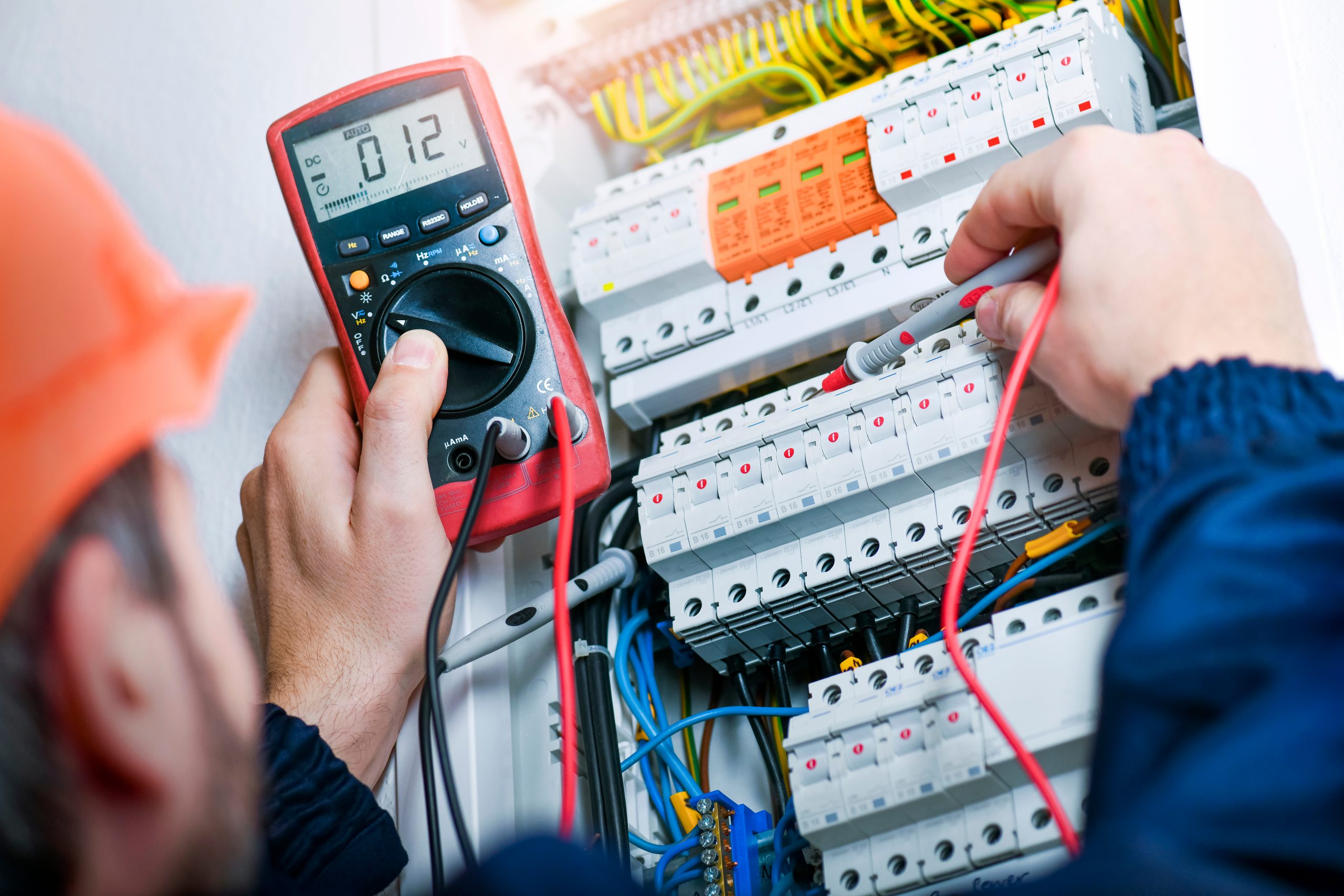 Electrician,Installing,Electric,Cable,Wires,And,Fuse,Switch,Box.,Multimeter