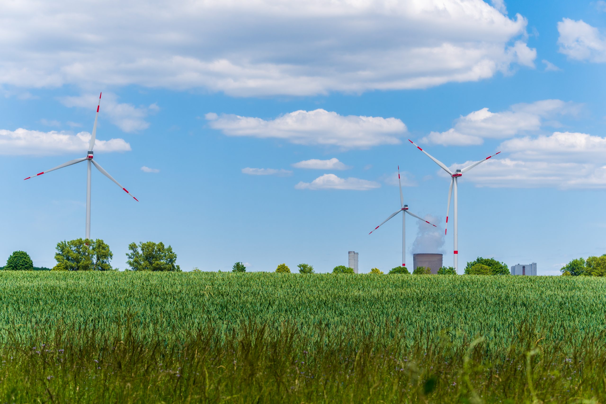 Wind,Turbines,And,Electric,Power,Plant,With,Smoking,Chimney,In