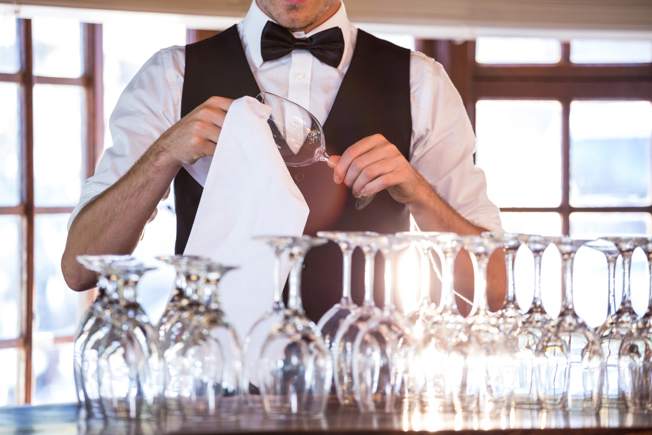 Hospitality Bar Tender Cleaning Wine Glasses