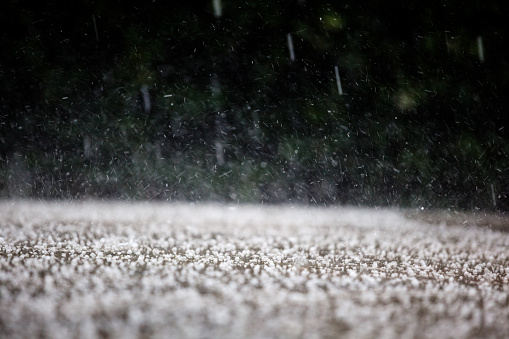 Raining in the neighborhood. Visible rain drops everywhere. Tornado Destroyed Building