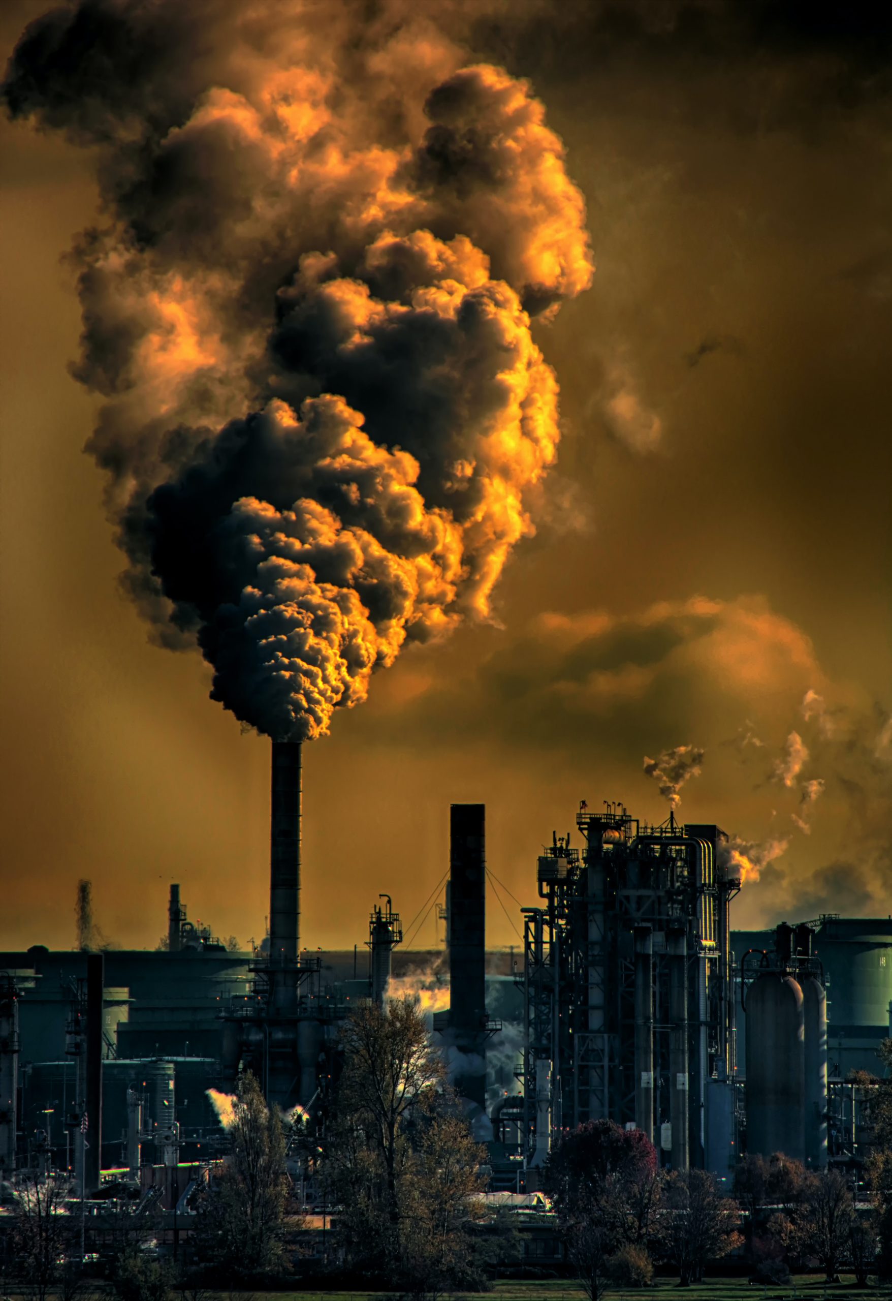 Dark Brown Sky With Polluting Tower In Foreground