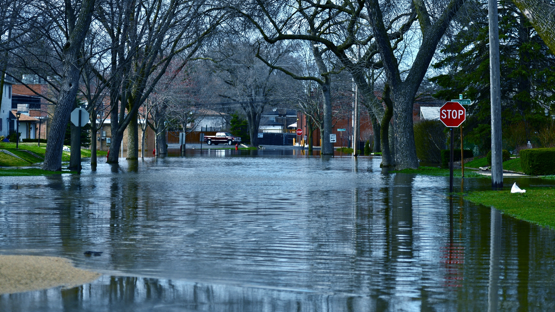 Flooded Street with Stop Sign Flooded Street with Stop Sign