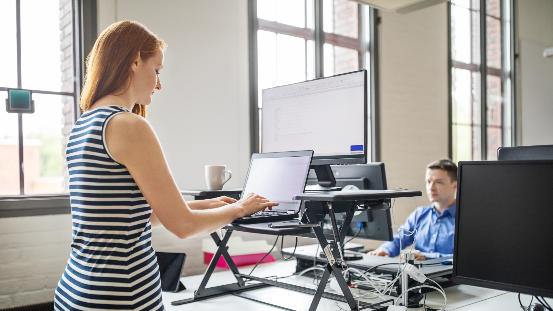 Woman Working at Standing Desk Woman Working at Standing Desk