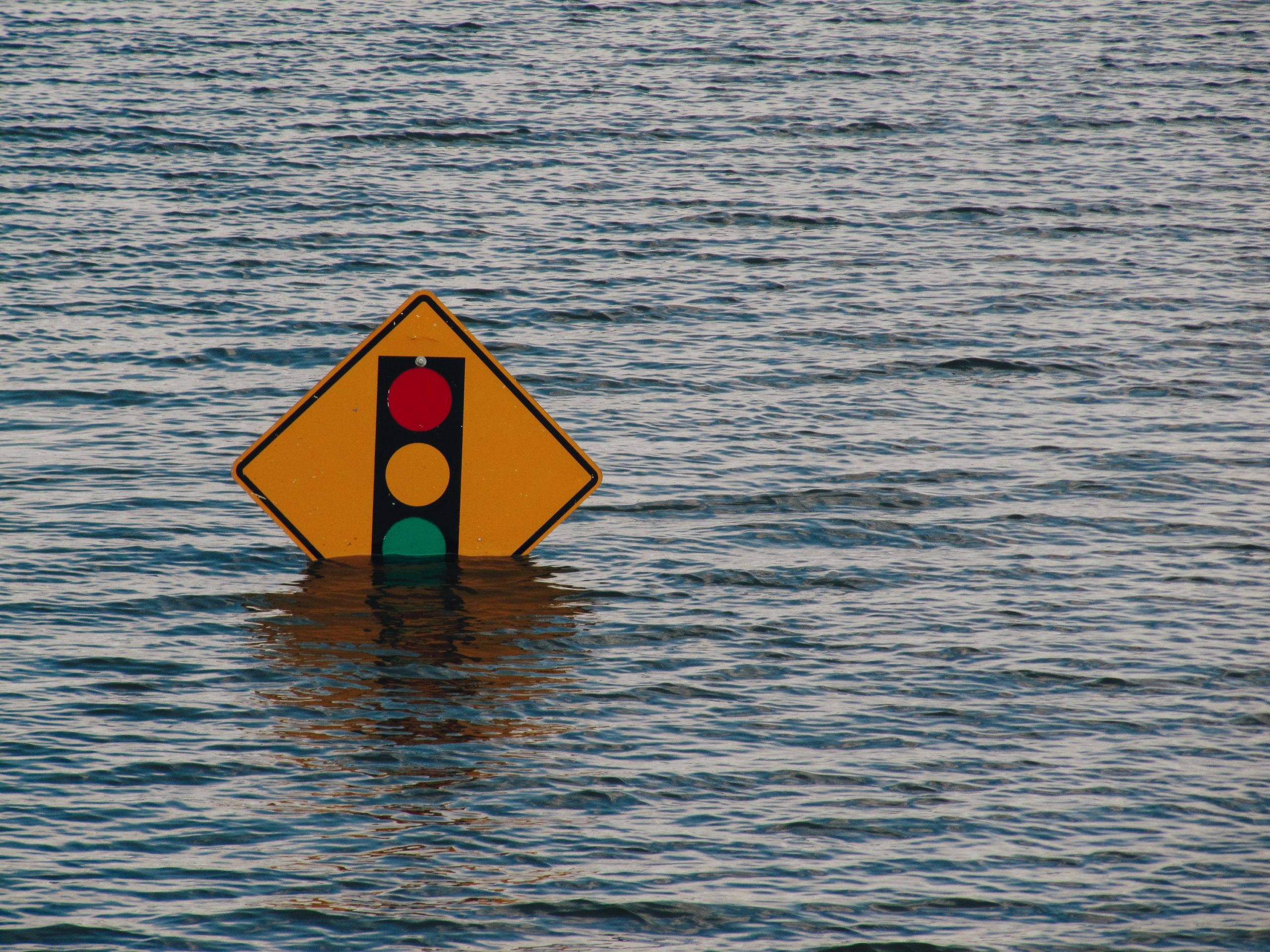 Road Sign Halfway Underwater in Flood