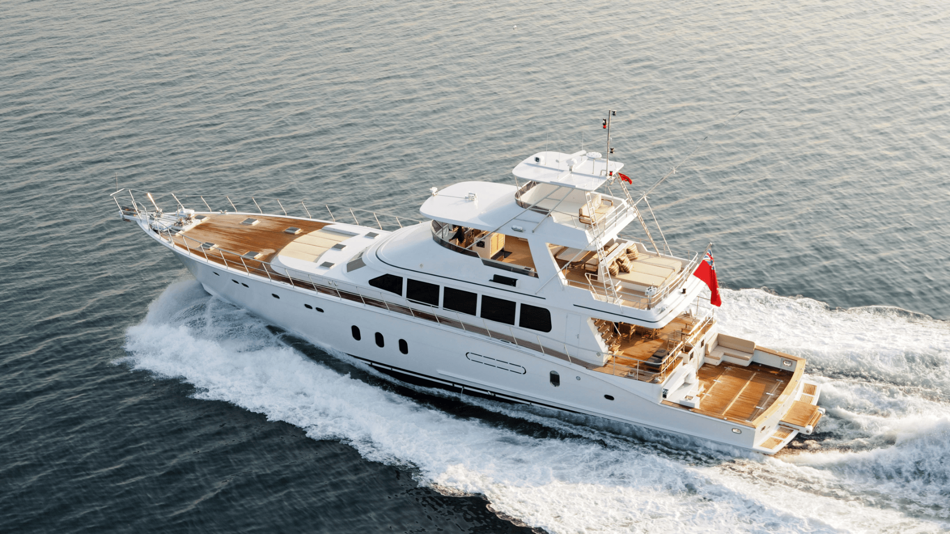 Aerial View of White Yacht Leaving a Wake