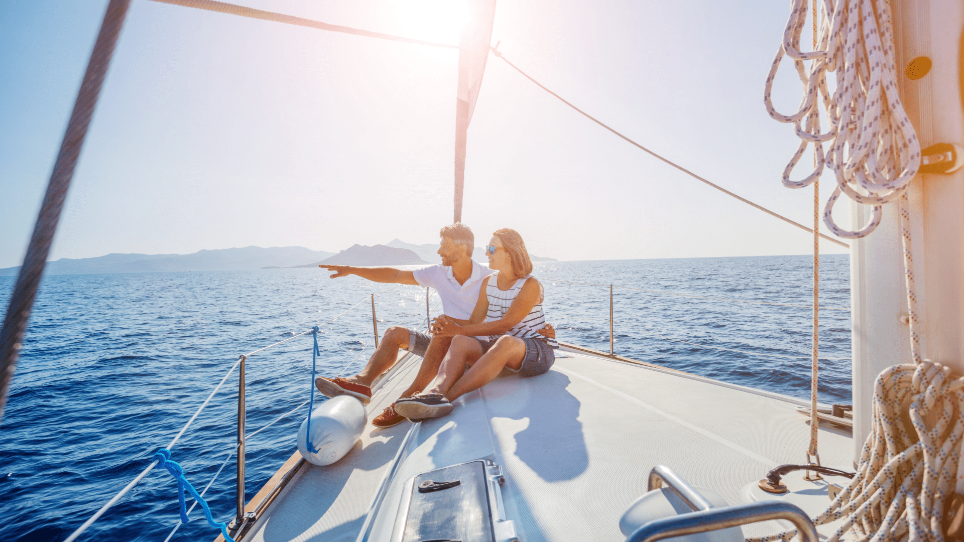 Middle Aged Couple on Yacht at Sunset Middle Aged Couple on Yacht at Sunset