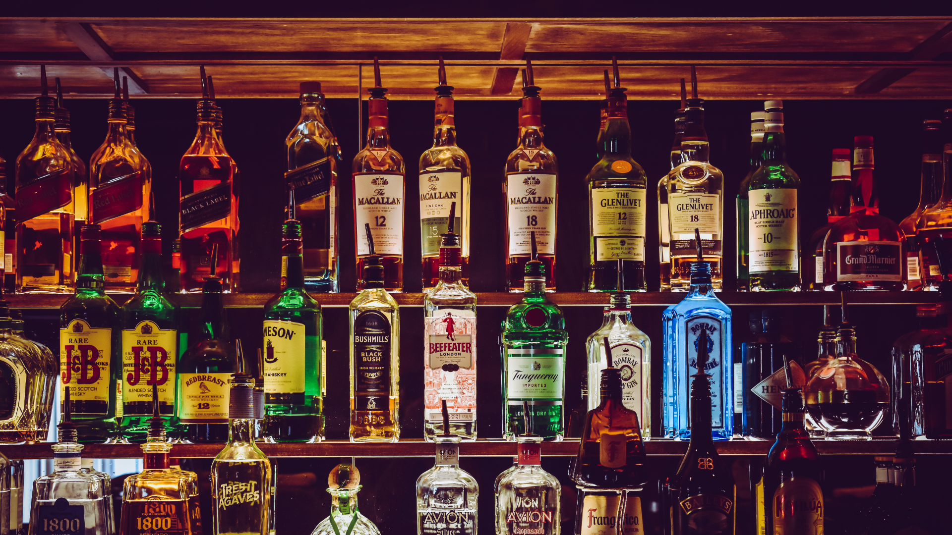 Three Shelves of Liquor at Bar