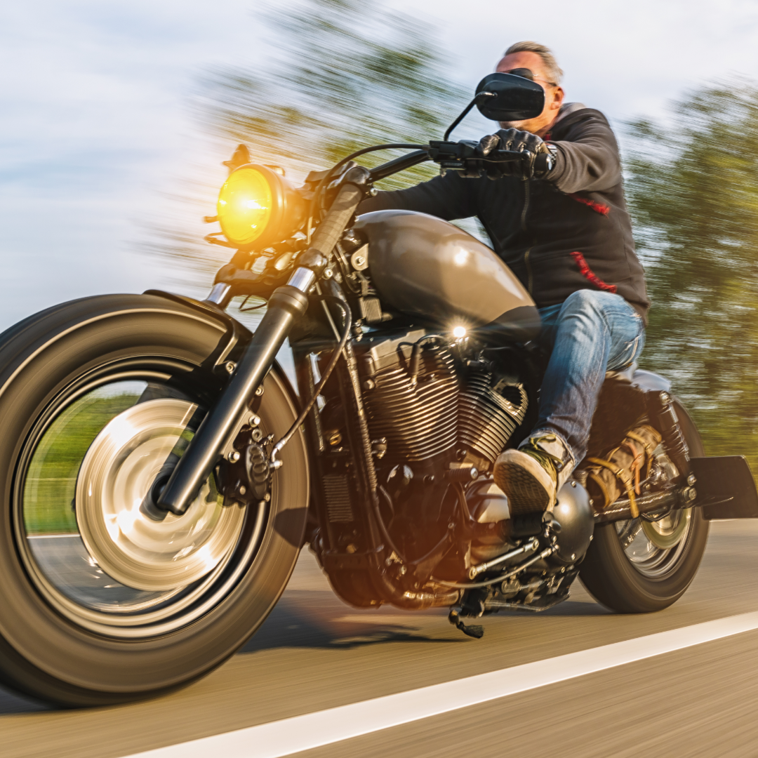 Man Driving Grey Harley Davidson Motorcycle