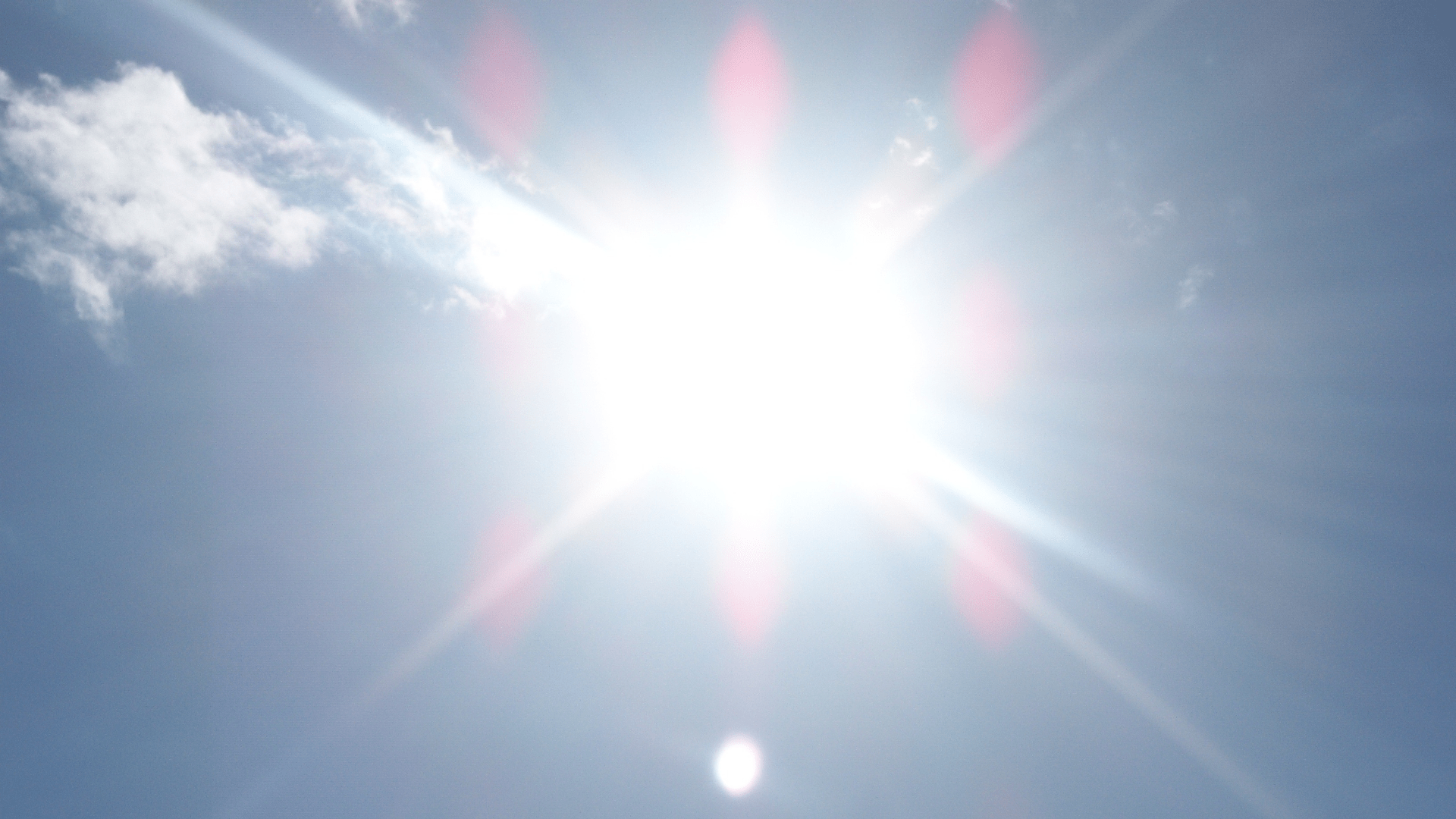 Looking Up at Bright Sun with One Cloud in the Sky Looking Up at Bright Sun with One Cloud in the Sky