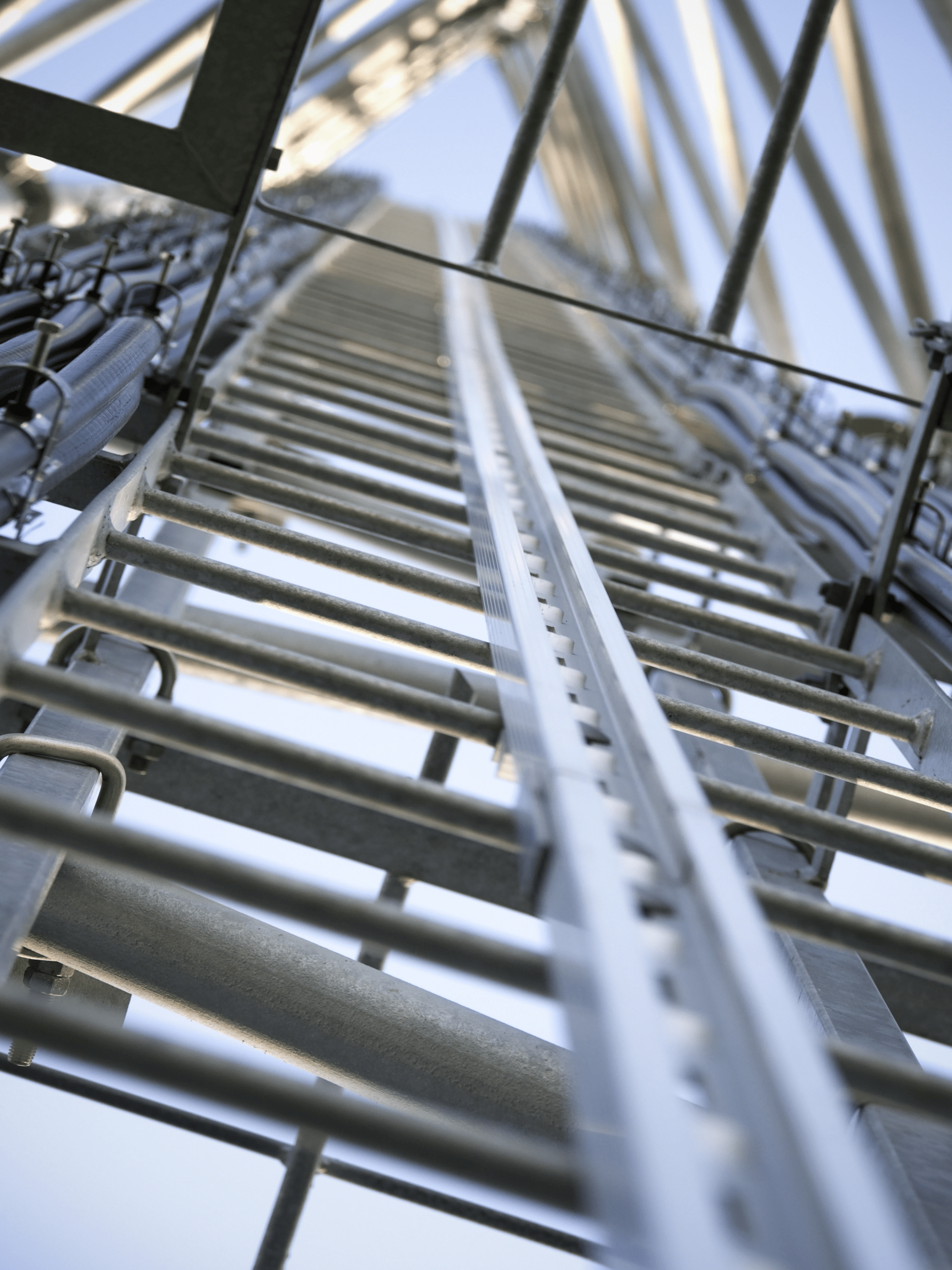Looking Up at Ladder Inside Telecommunications Tower Looking Up at Ladder Inside Telecommunications Tower