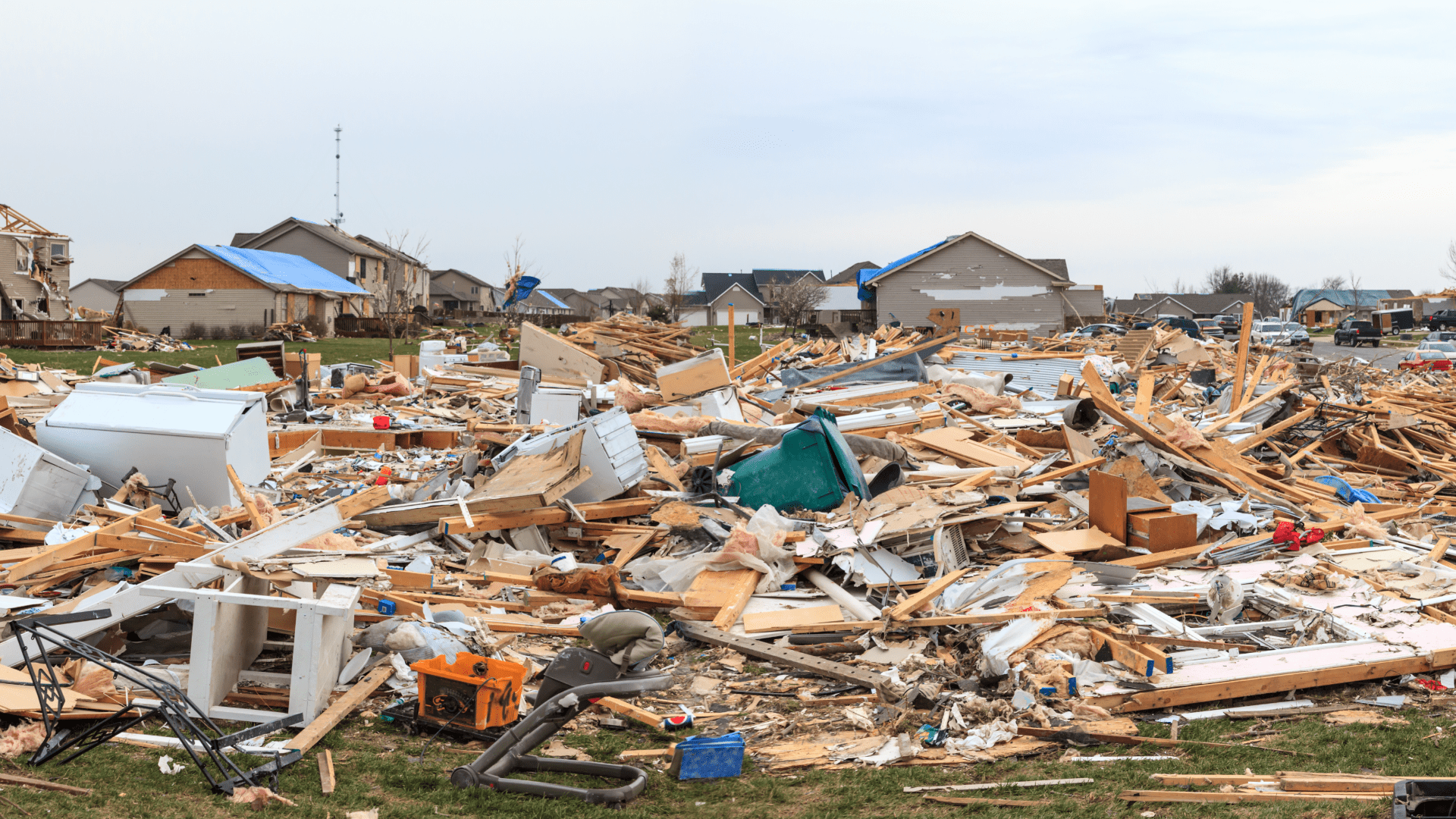 Aftermath of Tornado Damage with Collapsed Houses and Debris