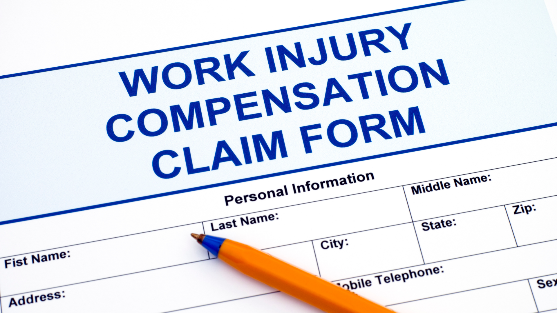 Workers Compensation Form in Blue Ink with Orange and Blue Pen on Top