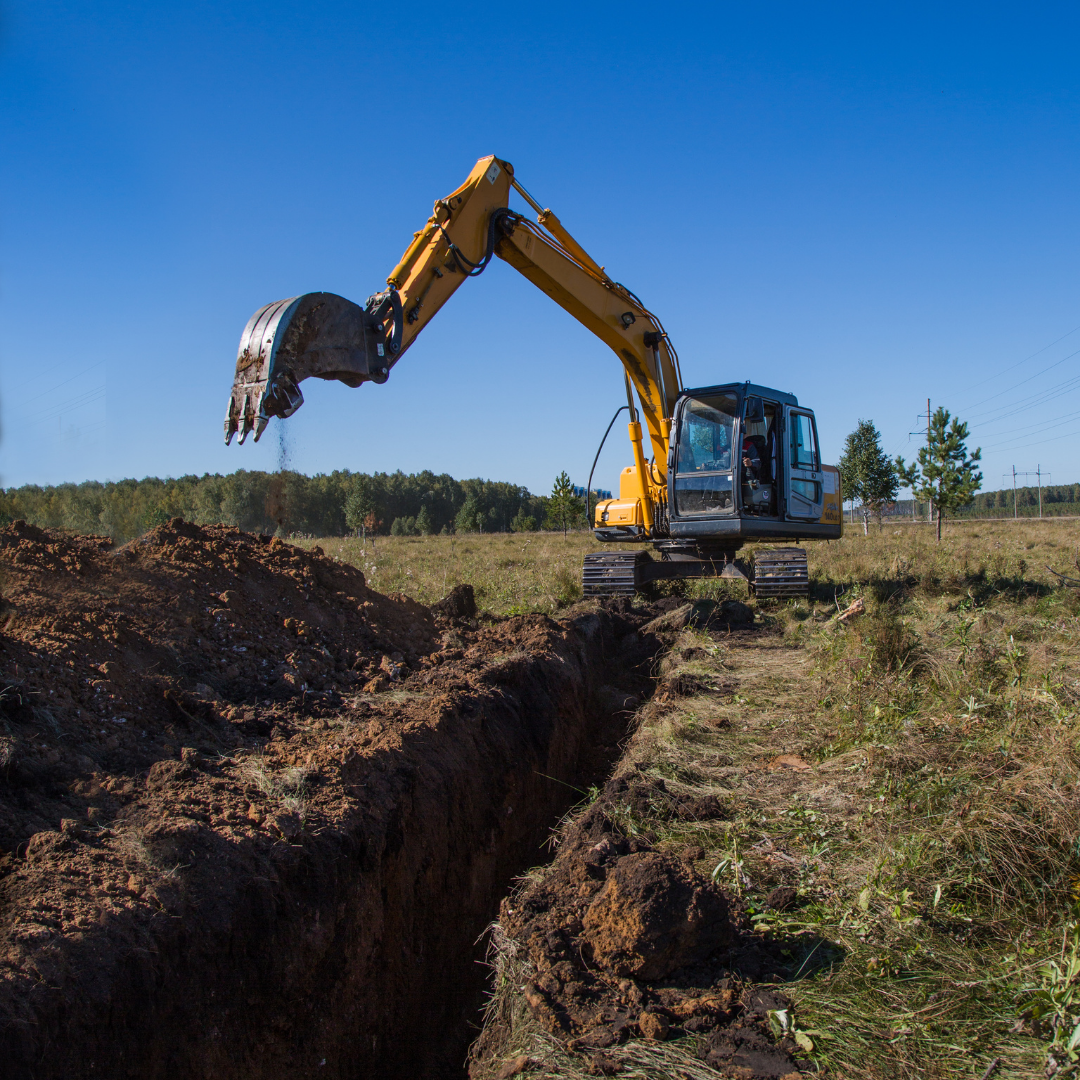 Machine digging a trench