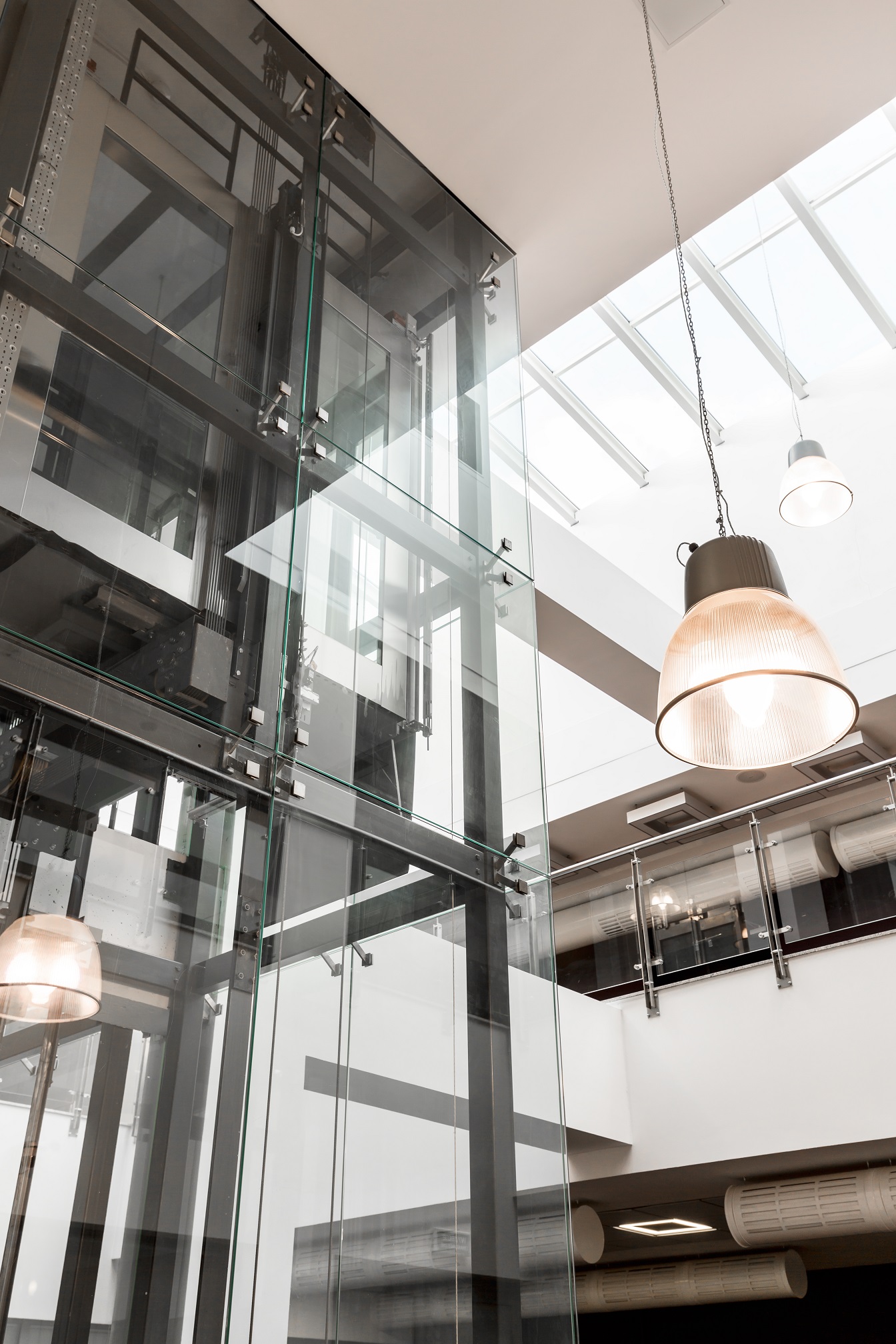 Glass elevator in modern building Dual Elevators In Office Building