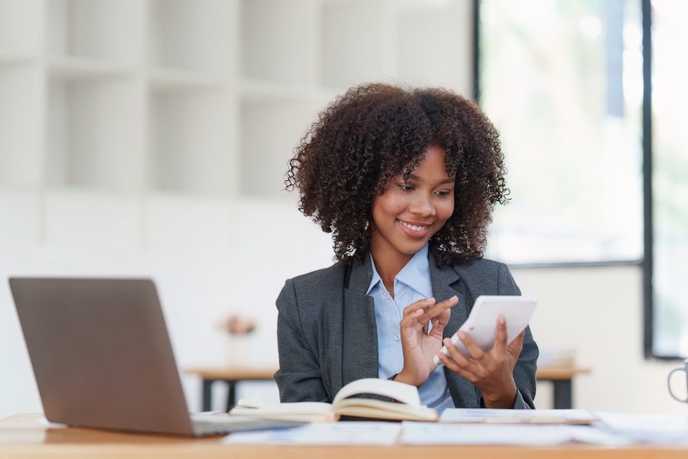 Financial advisor, corporate accountant and african woman in office. analyzing benefits, enjoying financial success, job high result Engineer,Architect,Foreman,On,Construction,Site,With,Tablet,Computer