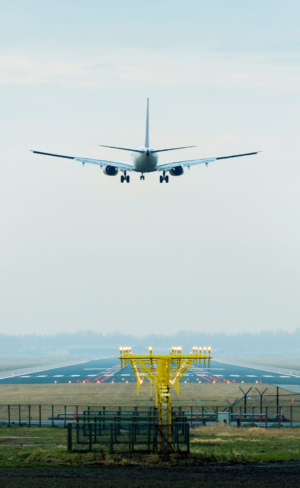 Aeroplane coming in to land, Amsterdam airport Shiphol Tower Street Insurance Loss Control OSHA Safe and Sound Week Safety and Health